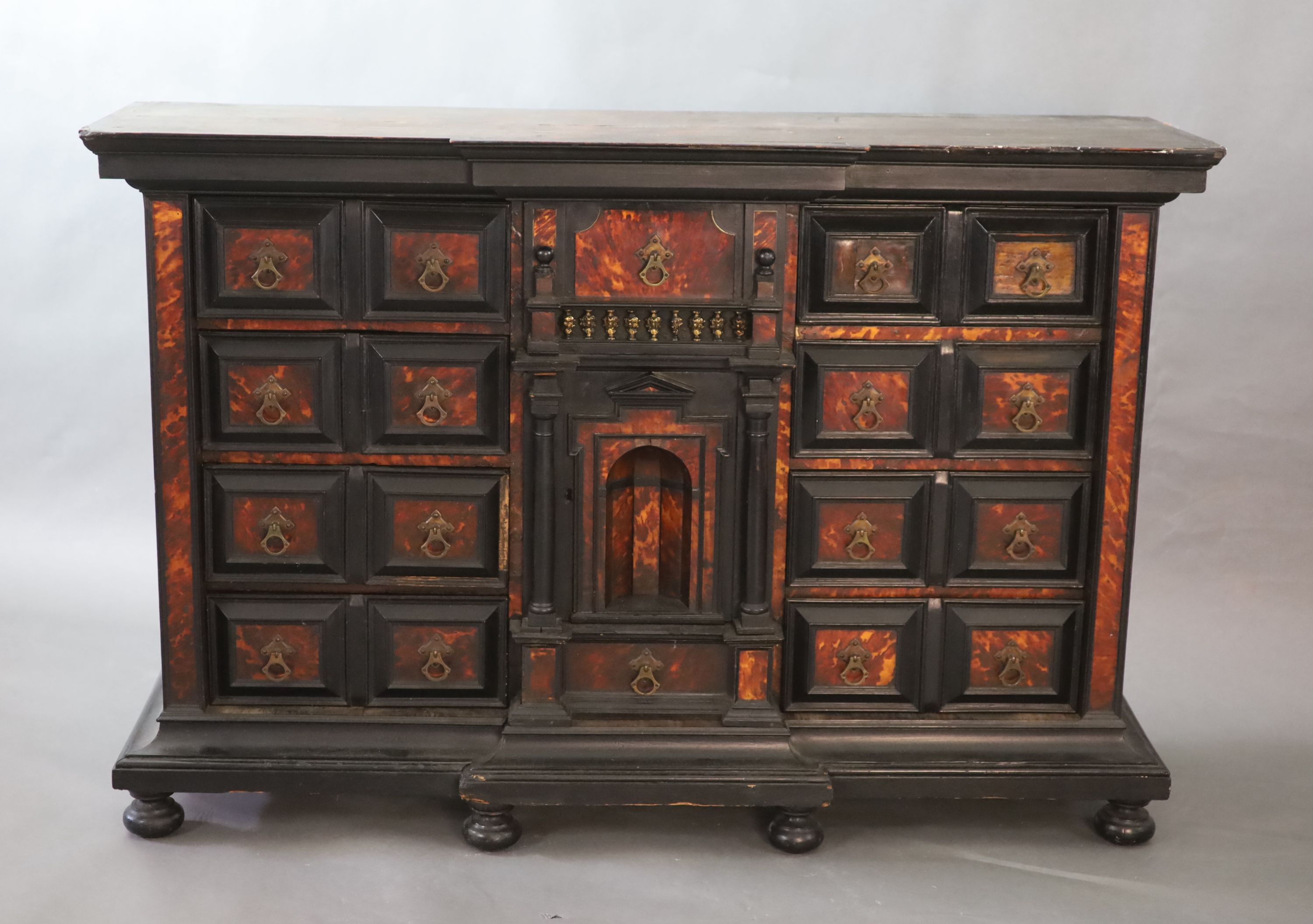 A late 17th century Portuguese ebony and tortoiseshell table cabinet, W.128cm D.39cm H.85cm